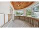 Unique living area with wood ceilings, new flooring, and walls that have been prepped at 1810 Maryland Ne Ave, St Petersburg, FL 33703