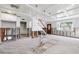 Open-concept room with staircase, large windows, and coffered ceiling during renovation at 1810 Maryland Ne Ave, St Petersburg, FL 33703