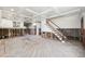Open-concept room with staircase, large windows, and coffered ceiling during renovation at 1810 Maryland Ne Ave, St Petersburg, FL 33703