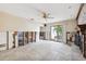 Spacious living room featuring tile flooring, ceiling fan, and sliding glass doors to the backyard at 1810 Maryland Ne Ave, St Petersburg, FL 33703