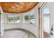 Sunroom featuring unique wood ceiling, curved window, and neutral flooring at 1810 Maryland Ne Ave, St Petersburg, FL 33703