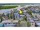 Aerial view of waterfront home with lush landscaping and nearby waterway access at 18198 3Rd E St, Redington Shores, FL 33708