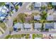 An aerial view of the home's neighborhood, showcasing well-maintained properties and tree-lined streets at 18198 3Rd E St, Redington Shores, FL 33708