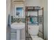 Powder room with a pedestal sink, mosaic backsplash and stylish fixtures at 18198 3Rd E St, Redington Shores, FL 33708