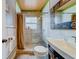 Bathroom featuring a walk-in tiled shower and a unique decorative mirror at 18198 3Rd E St, Redington Shores, FL 33708