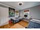 Shared bedroom featuring two twin beds, study area, and wood floors at 18198 3Rd E St, Redington Shores, FL 33708
