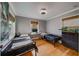 Shared bedroom featuring two twin beds, study area, and wood floors at 18198 3Rd E St, Redington Shores, FL 33708