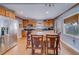 Bright kitchen featuring wood cabinets, stainless steel appliances, and a center island with bar stool seating at 18198 3Rd E St, Redington Shores, FL 33708
