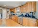 Bright kitchen features stainless steel appliances, wood cabinets and granite countertops at 18198 3Rd E St, Redington Shores, FL 33708
