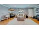 Inviting living room with comfortable seating, a neutral color palette, and natural light from large windows at 18198 3Rd E St, Redington Shores, FL 33708