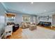 Cozy living room with light grey walls, recessed lighting, wood floors, and stylish furniture at 18198 3Rd E St, Redington Shores, FL 33708