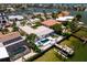 Beautiful waterfront estate with a pool, private dock, and lush tropical landscaping at 243 Hermosita Dr, St Pete Beach, FL 33706