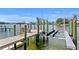 Waterfront property featuring private boat lift for easy water access and boating adventures at 243 Hermosita Dr, St Pete Beach, FL 33706