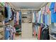 A spacious walk-in closet with custom shelving and drawers provides ample storage space at 243 Hermosita Dr, St Pete Beach, FL 33706