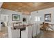 Bright dining room with unique wood ceiling, art, and decor accents at 243 Hermosita Dr, St Pete Beach, FL 33706
