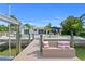 Waterfront living with a private dock, seating area, and a boat lift at 243 Hermosita Dr, St Pete Beach, FL 33706