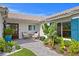Charming front porch with comfortable seating and lush landscaping at 243 Hermosita Dr, St Pete Beach, FL 33706
