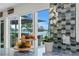 Bright kitchen counter with white flower, and view of the bay at 243 Hermosita Dr, St Pete Beach, FL 33706