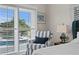 Comfortable bedroom chair overlooking outdoor swimming pool area at 243 Hermosita Dr, St Pete Beach, FL 33706