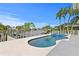Stunning waterfront pool with spa and lush tropical landscaping, perfect for relaxation and entertaining outdoors at 243 Hermosita Dr, St Pete Beach, FL 33706