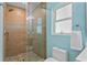 Walk-in shower with stylish tile, glass door, and a modern showerhead for a luxurious experience at 243 Hermosita Dr, St Pete Beach, FL 33706