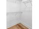 Walk-in closet features wood-look floors and wire shelving at 2608 W Columbus Dr # 3, Tampa, FL 33607