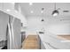 Modern kitchen with stainless steel appliances, marble countertops, and light wood floors at 2608 W Columbus Dr # 3, Tampa, FL 33607