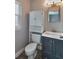 Charming bathroom features a vanity with storage, a toilet, and a bright window at 2933 Stratford Dr, Largo, FL 33771