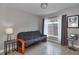 Cozy room features a futon and a window with natural light, complemented by modern décor at 2933 Stratford Dr, Largo, FL 33771