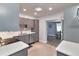 Updated kitchen features gray cabinets, stainless steel appliances, and ample counter space at 2933 Stratford Dr, Largo, FL 33771
