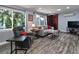 Inviting living room featuring large windows, comfortable seating, and stylish decor at 2933 Stratford Dr, Largo, FL 33771