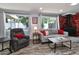 Cozy living room with modern furnishings and a unique stone accent wall at 2933 Stratford Dr, Largo, FL 33771