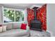 Comfortable seating area with large window views and stone fireplace at 2933 Stratford Dr, Largo, FL 33771