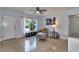 Bright living room with large windows, comfortable seating, and neutral décor, creating a welcoming space at 2933 Stratford Dr, Largo, FL 33771