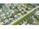 Aerial view of neighborhood featuring a well-maintained, single-story home with a circular driveway at 3300 58Th N St, St Petersburg, FL 33710