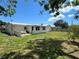 Large, fenced backyard with a charming patio area for outdoor relaxation at 3300 58Th N St, St Petersburg, FL 33710