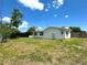 Well-maintained backyard with a partial view of the home's exterior at 3300 58Th N St, St Petersburg, FL 33710