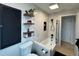Contemporary bathroom with shower over tub, floating shelves, and modern fixtures for a spa-like experience at 3300 58Th N St, St Petersburg, FL 33710