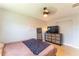 Bedroom featuring a dresser with a TV, a ceiling fan, and neutral paint at 3300 58Th N St, St Petersburg, FL 33710