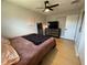 Cozy bedroom featuring wood-look flooring, ceiling fan, and stylish furnishings with a warm, inviting ambiance at 3300 58Th N St, St Petersburg, FL 33710