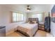 Cozy bedroom featuring a ceiling fan and natural light from two bright windows at 3300 58Th N St, St Petersburg, FL 33710