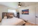 Bright bedroom features a ceiling fan, plank floors and natural light at 3300 58Th N St, St Petersburg, FL 33710