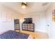 Bedroom featuring a dresser with a TV, a ceiling fan, and neutral paint at 3300 58Th N St, St Petersburg, FL 33710