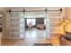 Bonus room or office space separated from the main living area with large sliding barn doors at 3300 58Th N St, St Petersburg, FL 33710