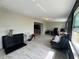 Spacious bonus room featuring light tile floor, ample light, and casual furniture at 3300 58Th N St, St Petersburg, FL 33710