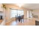 Dining area featuring hardwood floors, modern lighting, and large bay windows at 3300 58Th N St, St Petersburg, FL 33710