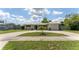 Inviting single-story home with a manicured lawn, long driveway, and one car garage, perfect for suburban living at 3300 58Th N St, St Petersburg, FL 33710