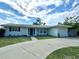 Charming single-story home with well-manicured lawn and a driveway at 3300 58Th N St, St Petersburg, FL 33710