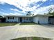 Charming single-story home featuring a well-maintained lawn, a concrete driveway, and a one-car garage at 3300 58Th N St, St Petersburg, FL 33710