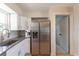 Bright kitchen featuring granite countertops, stainless steel appliances, and white cabinets at 3300 58Th N St, St Petersburg, FL 33710